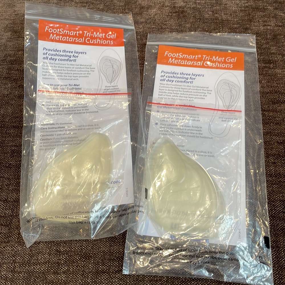 Two pairs of Footsmart tri-Met gel metatarsal cushions (new in package).